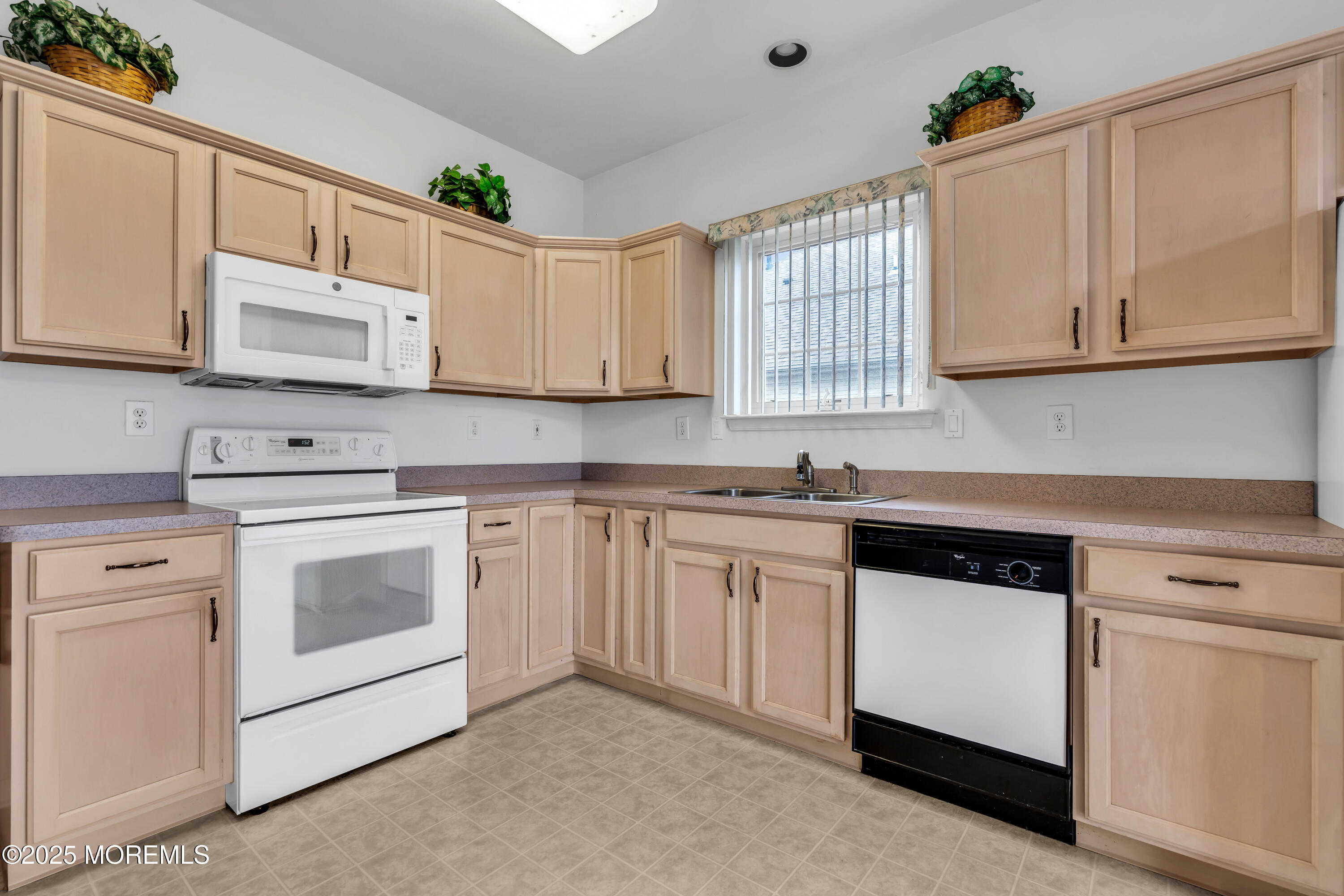 59 Drayton Road Manchester Township, NJ 08759 - Photo 13 of 38 a kitchen with granite countertop white cabinets and white appliances