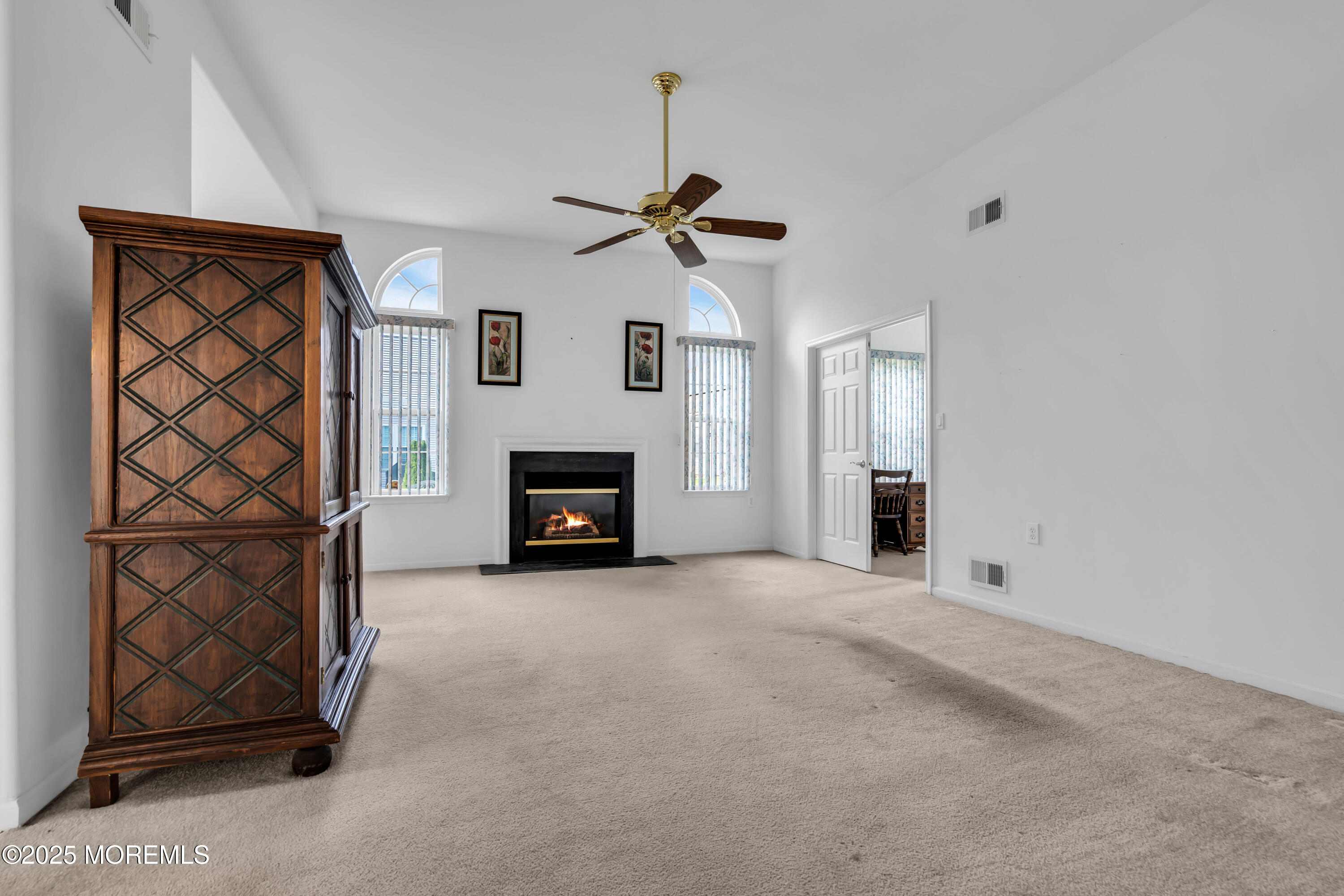 59 Drayton Road Manchester Township, NJ 08759 - Photo 15 of 38 an empty room with windows and fireplace