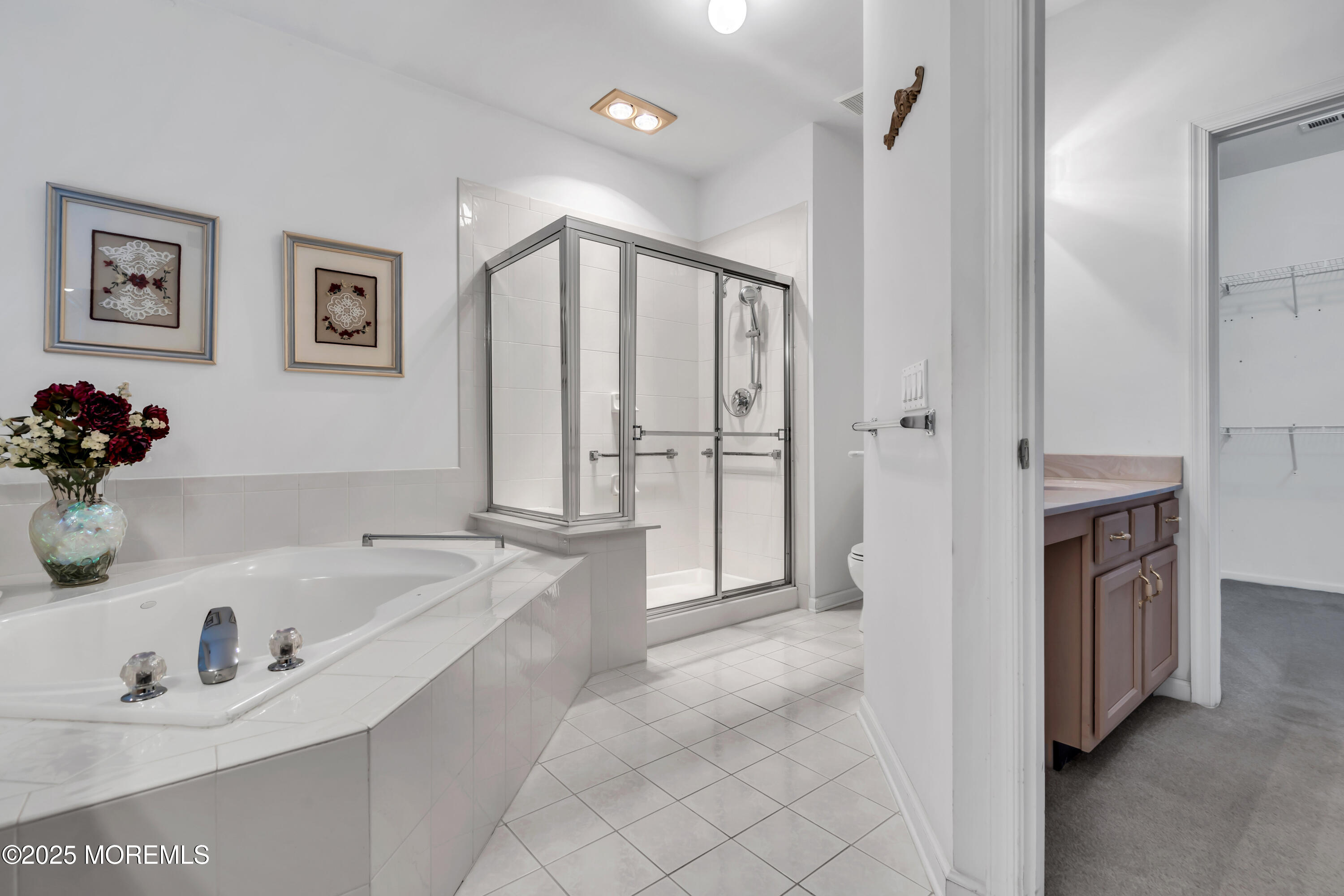 59 Drayton Road Manchester Township, NJ 08759 - Photo 19 of 38 a bathroom with a tub sink and mirror
