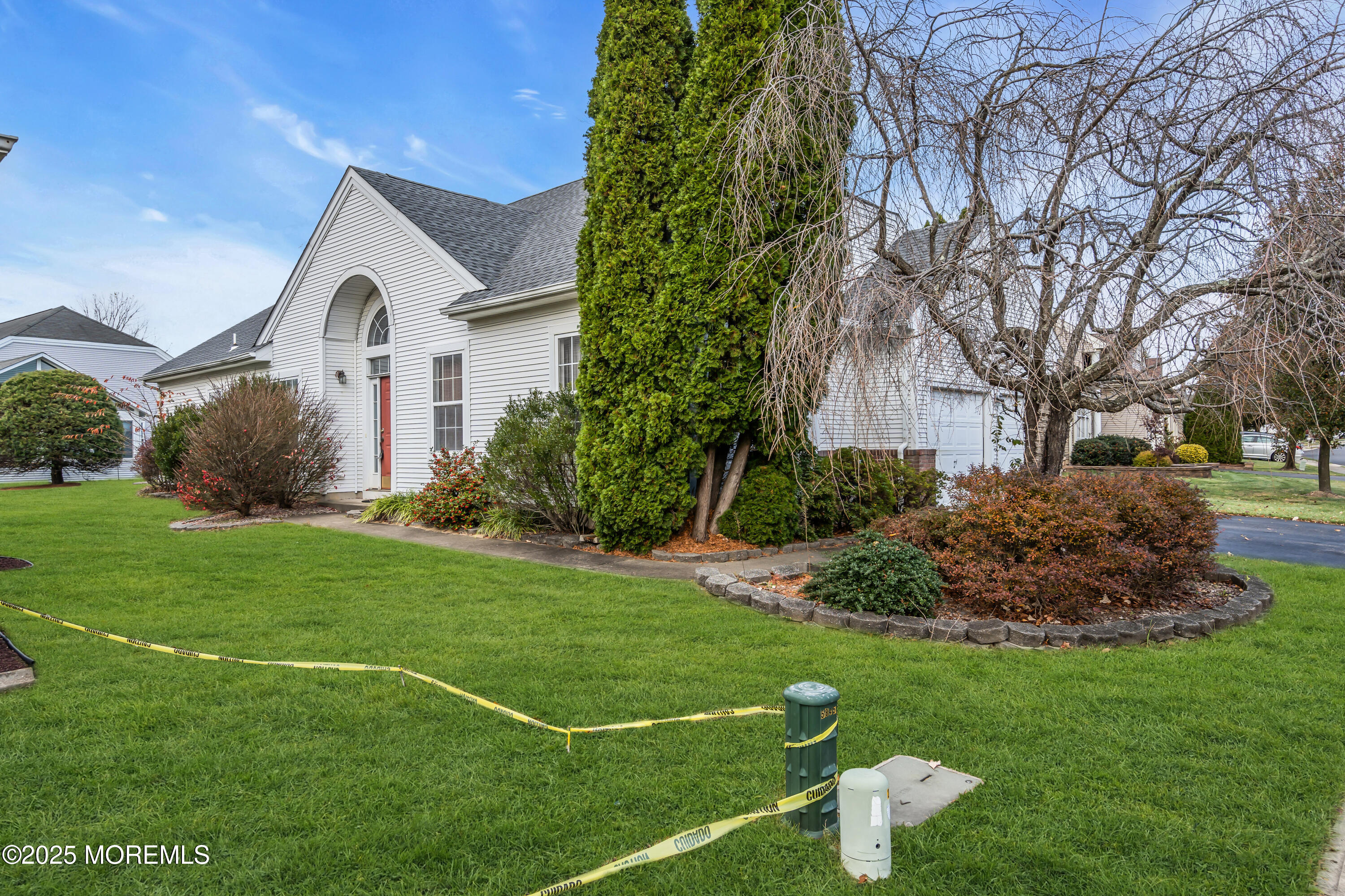 59 Drayton Road Manchester Township, NJ 08759 - Photo 4 of 38 a front view of a house with garden