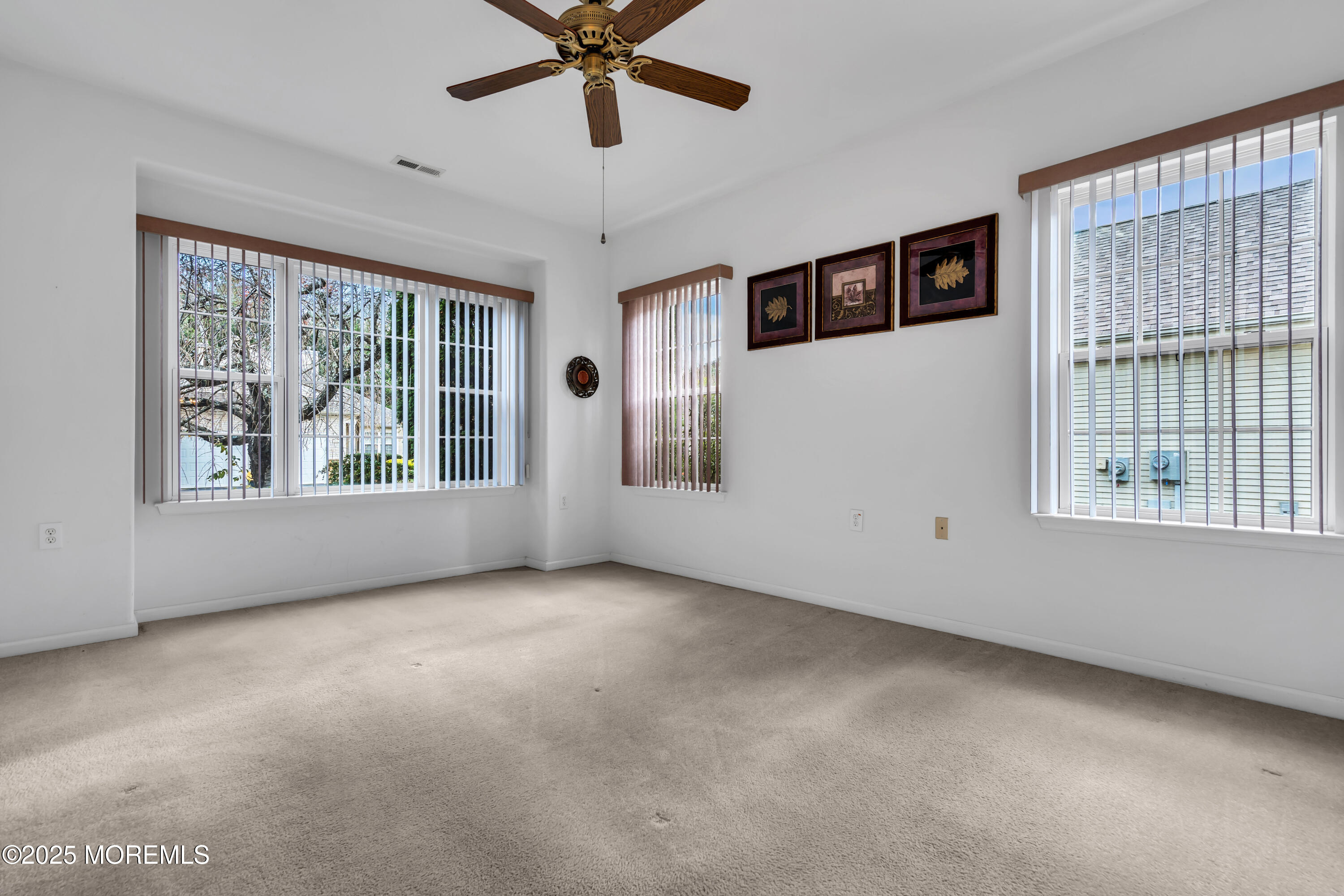 59 Drayton Road Manchester Township, NJ 08759 - Photo 8 of 38 wooden floor in an empty room with a window