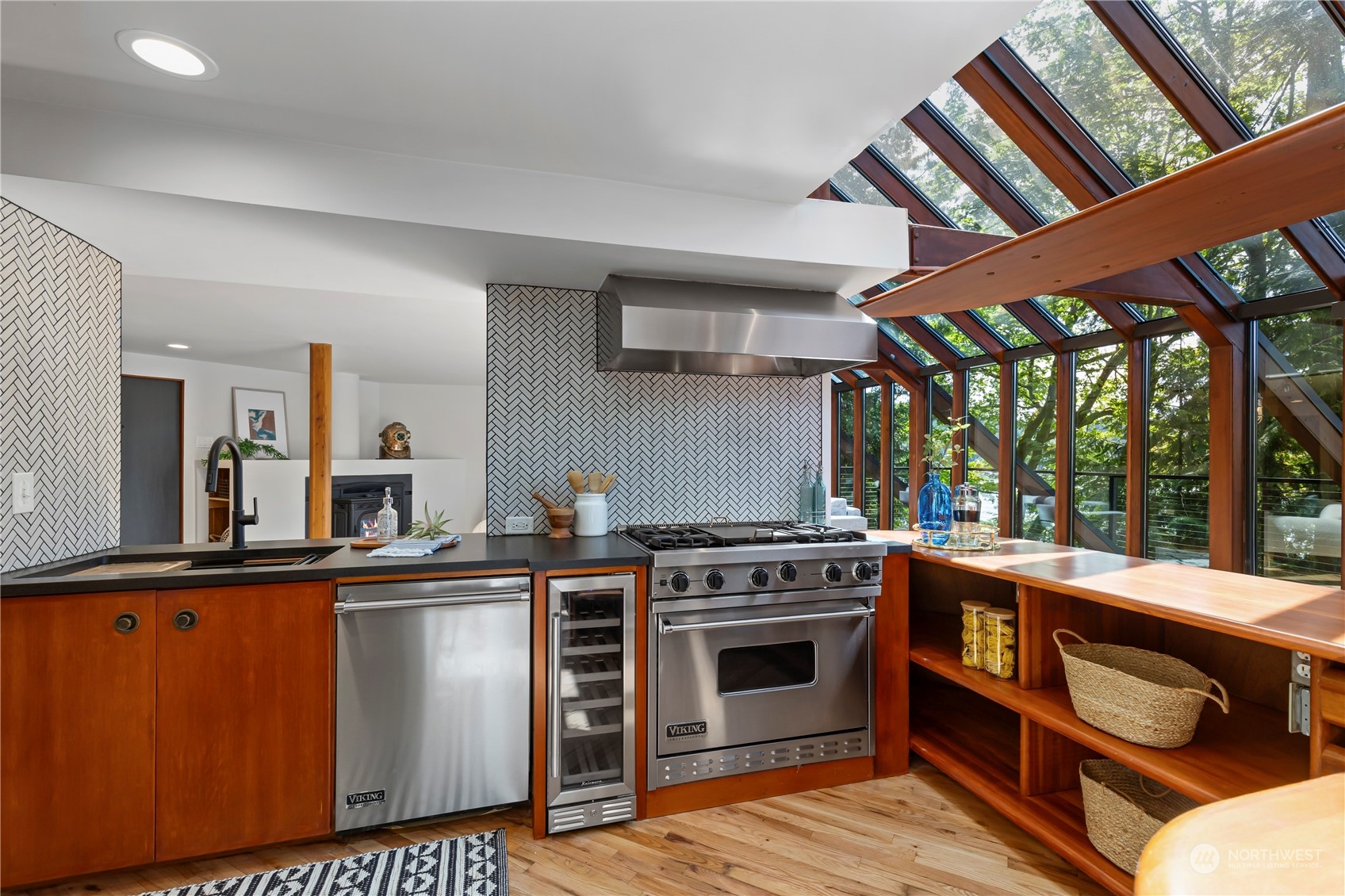 8100 Northeast Hidden Cove Road Bainbridge Island, WA 98110 - Photo 11 of 37 a kitchen with stainless steel appliances granite countertop a stove and a sink
