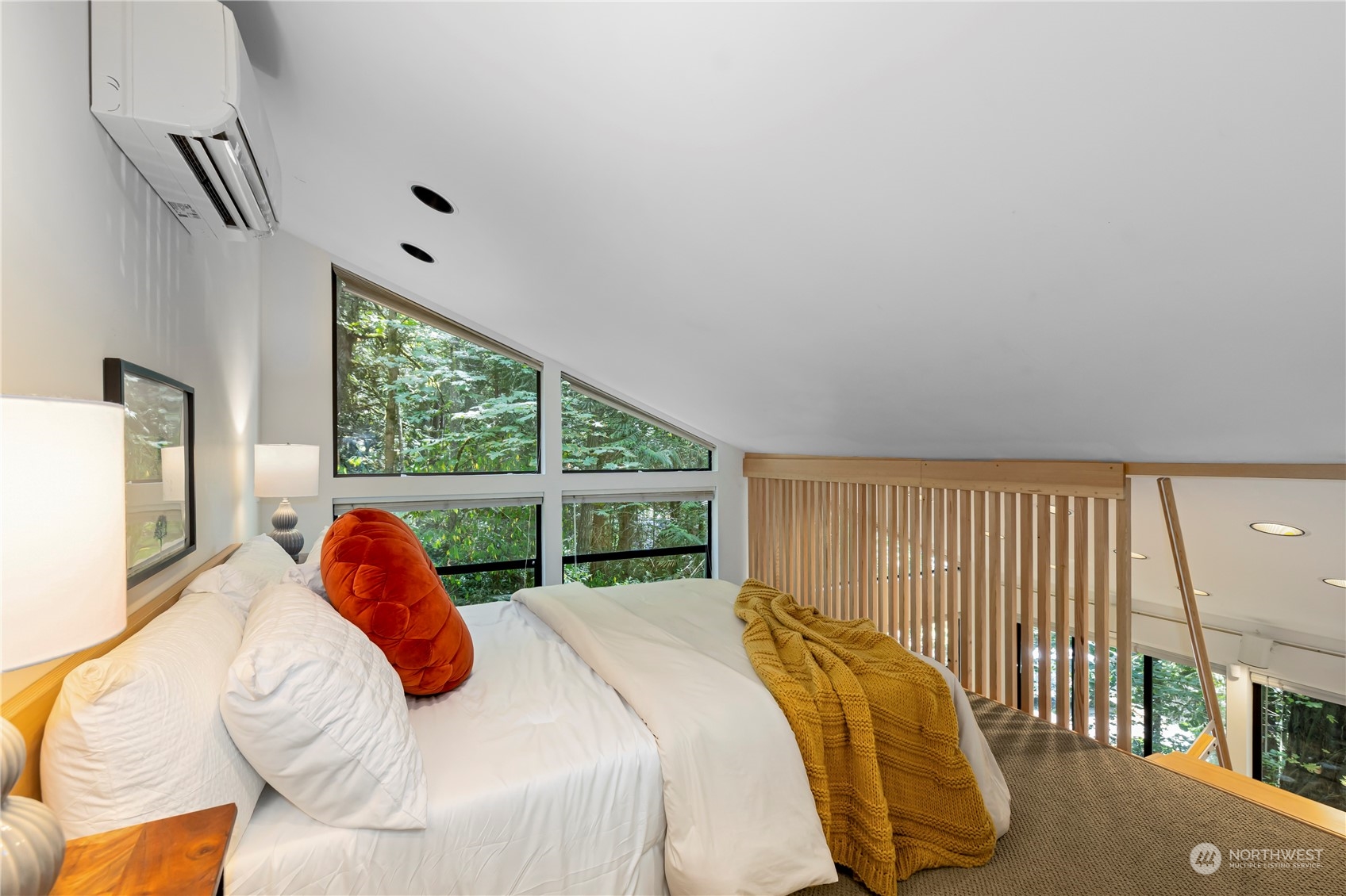 8100 Northeast Hidden Cove Road Bainbridge Island, WA 98110 - Photo 24 of 37 a bedroom with a bed and a large window