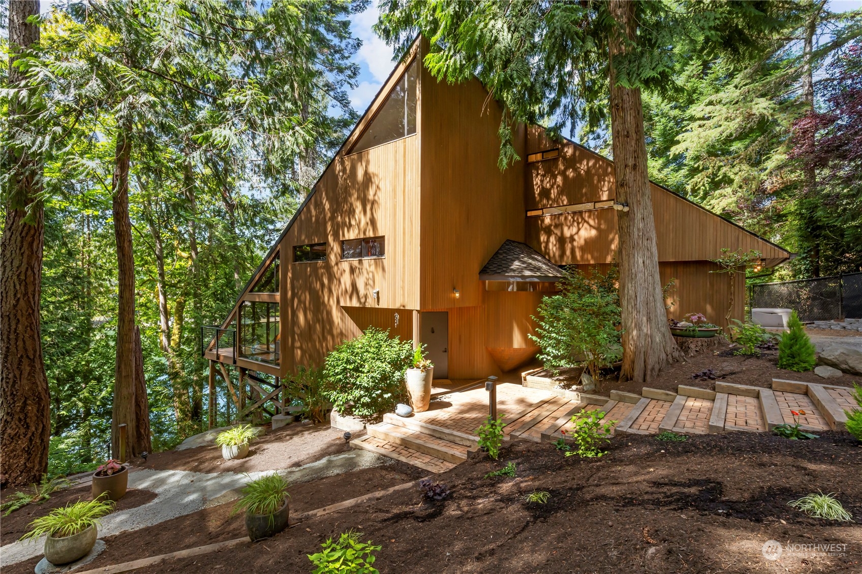 8100 Northeast Hidden Cove Road Bainbridge Island, WA 98110 - Photo 37 of 37 a view of a house with a yard