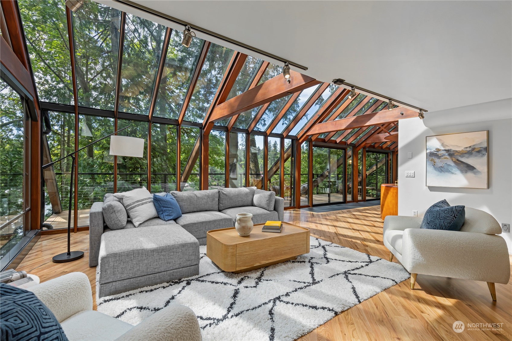 8100 Northeast Hidden Cove Road Bainbridge Island, WA 98110 - Photo 7 of 37 a living room with furniture and a large window