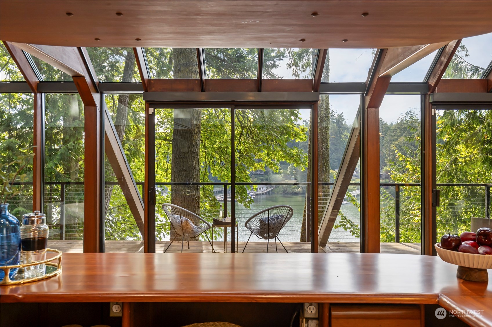 8100 Northeast Hidden Cove Road Bainbridge Island, WA 98110 - Photo 8 of 37 a view of a floor to ceiling window with wooden floor