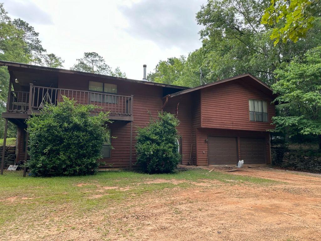 387 Jarrell Hogg Road West Point, GA 31833 - Photo 1 of 1 a tree in front of a house