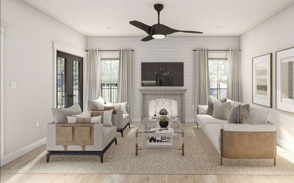 Lot 4 Groton Road Westford, MA 01886 - Photo 13 of 16 a living room with furniture a fireplace and a flat screen tv