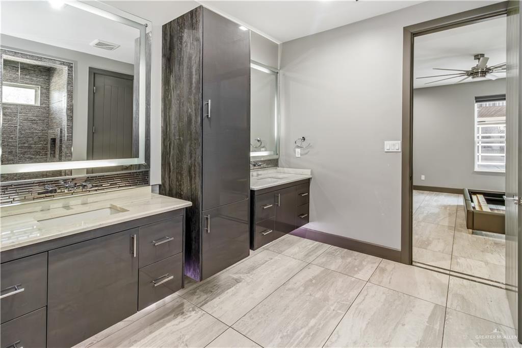 1828 Kilgore Avenue McAllen, TX 78504 - Photo 13 of 21 a spacious bathroom with a shower sink and mirror