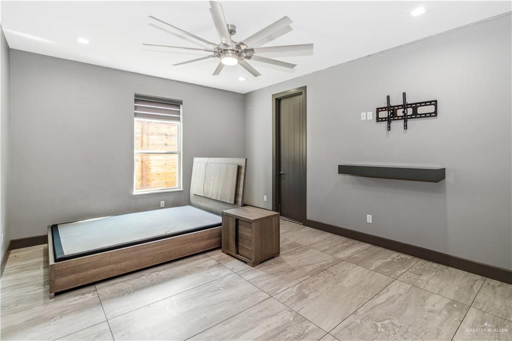 1828 Kilgore Avenue McAllen, TX 78504 - Photo 16 of 21 a bedroom with a bed and a window