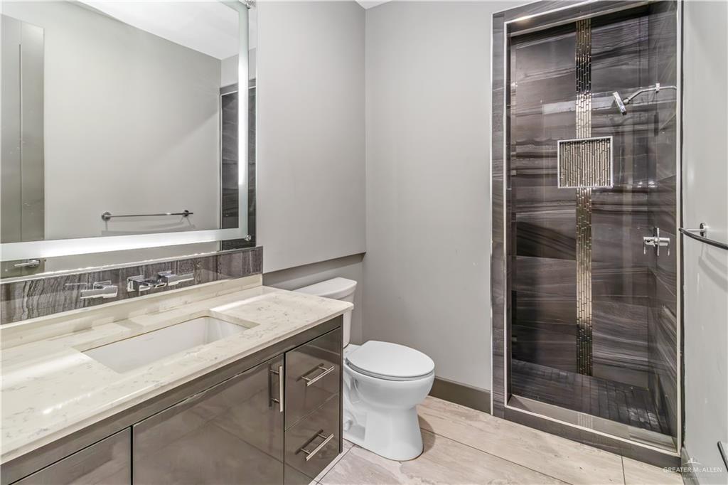 1828 Kilgore Avenue McAllen, TX 78504 - Photo 18 of 21 a bathroom with a sink a toilet and shower