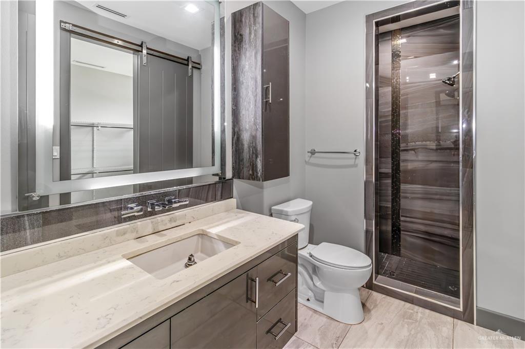1828 Kilgore Avenue McAllen, TX 78504 - Photo 20 of 21 a bathroom with a sink a toilet and shower