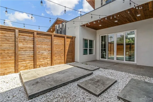 a spacious bedroom with a large bed and a couch