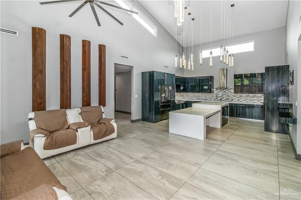 1828 Kilgore Avenue McAllen, TX 78504 - Photo 7 of 21 a living room with furniture and a chandelier
