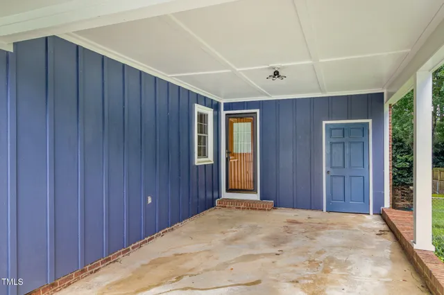 a bathroom with a granite countertop sink and a large mirror