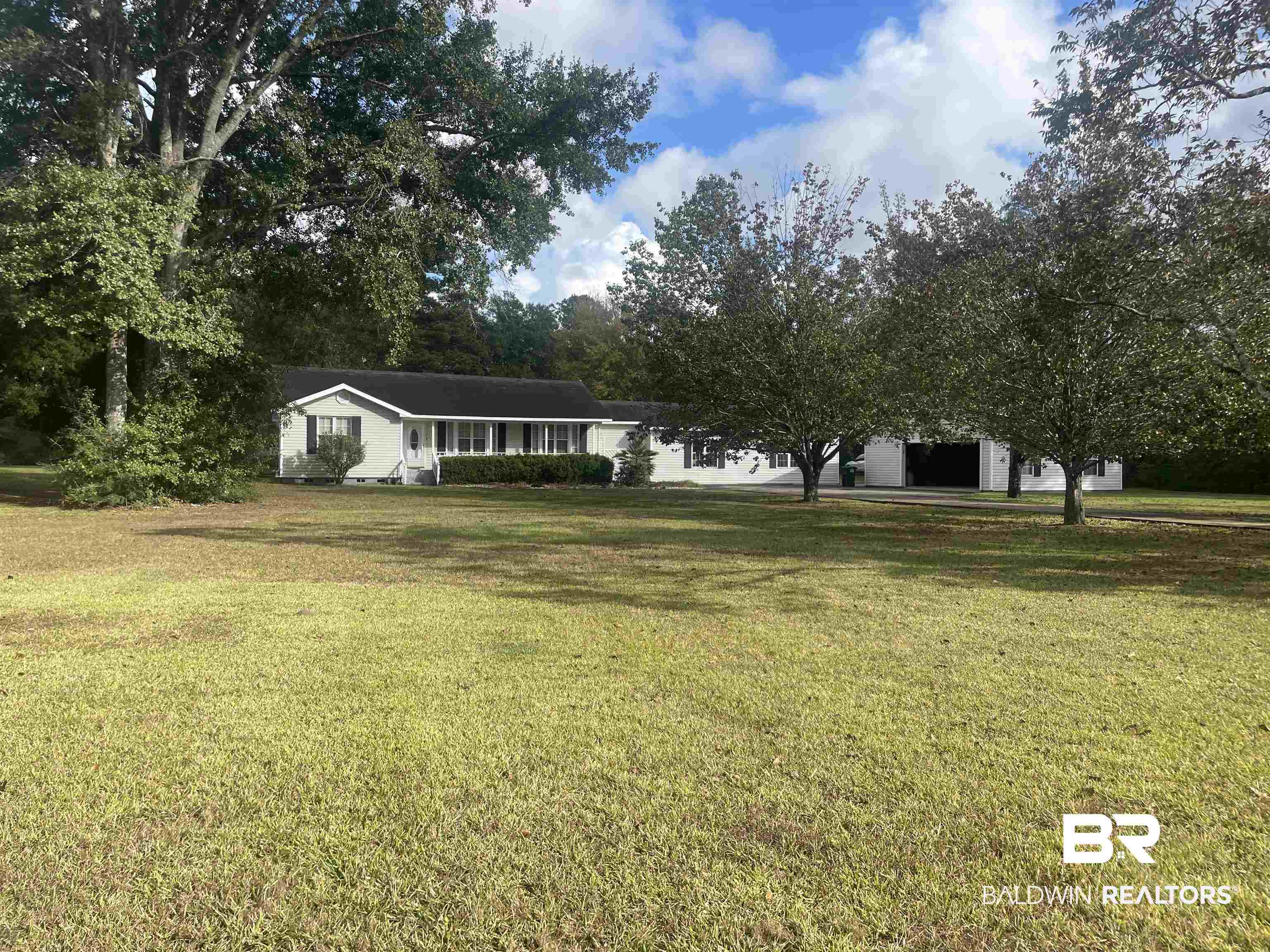 13850 Celeste Road Chunchula, AL 36521 - Photo 25 of 29 View of front of property with a front lawn and a garage
