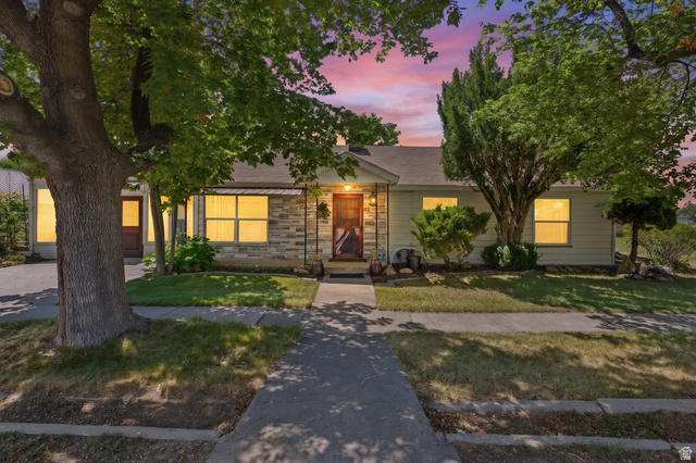 365 North Main Street Fillmore, UT 84631 - Photo 2 of 51 Ranch-style residence featuring a stone and siding exterior, established front yard landscaping, and a central walkway leading to the entry