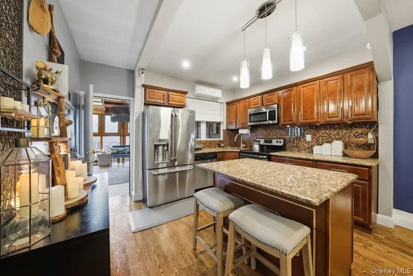 a kitchen with stainless steel appliances granite countertop a stove sink and cabinets