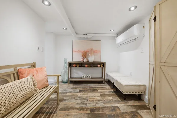 a front view of a building with a mountain