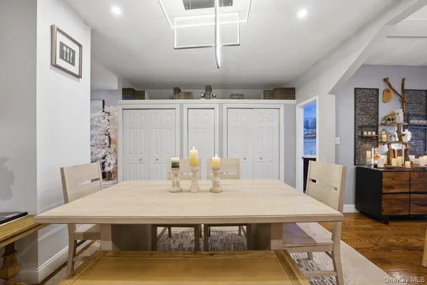 a room with patio furniture and a fireplace