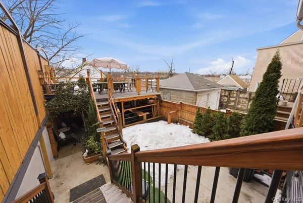 a front view of a building with a garden