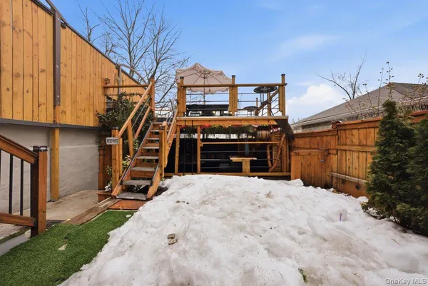 a front view of a residential apartment building with a yard