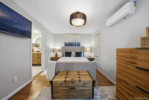 a bedroom with a bed and a dresser