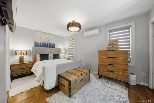 a bedroom with a bed and a chair