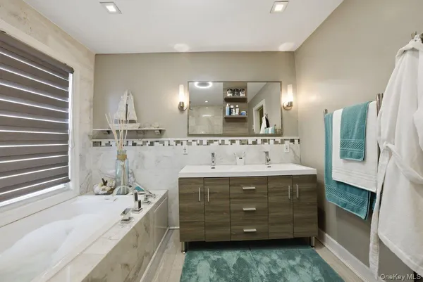 a bathroom with a bathtub and a shower