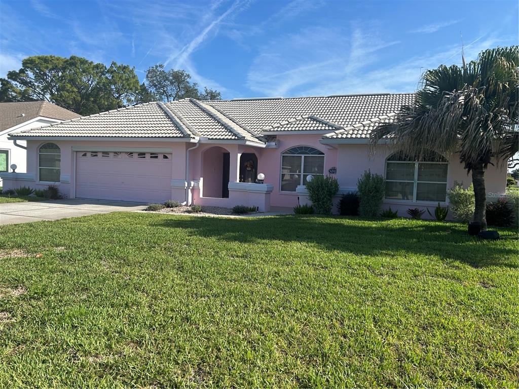 9376 Southern Belle Drive Weeki Wachee, FL 34613 - Photo 1 of 12 front view of a house with a yard