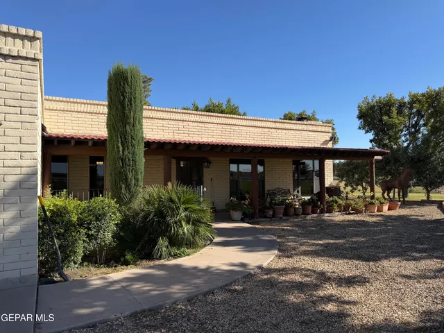 a front view of a house with yard