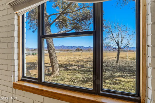 a large kitchen with stainless steel appliances granite countertop a stove and a sink