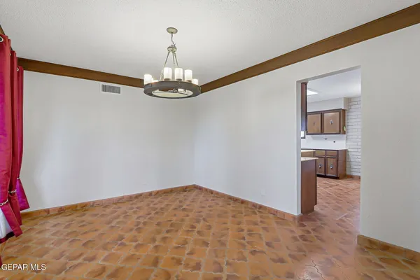 a kitchen with stainless steel appliances a sink stove and cabinets