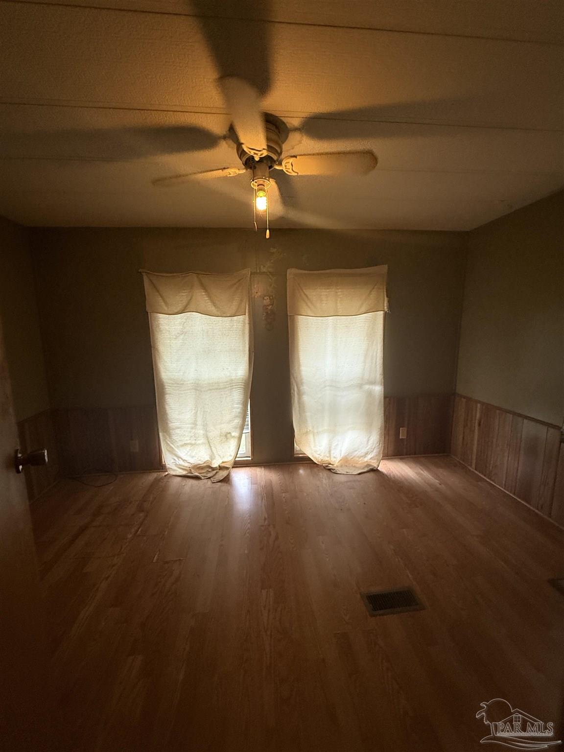 2866 Pine Forest Road, Unit 5 Cantonment, FL 32533 - Photo 3 of 10 a view of an empty room with a window