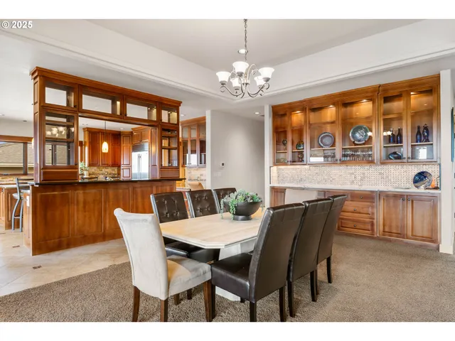 a view of a dining room with furniture large windows and wooden floor