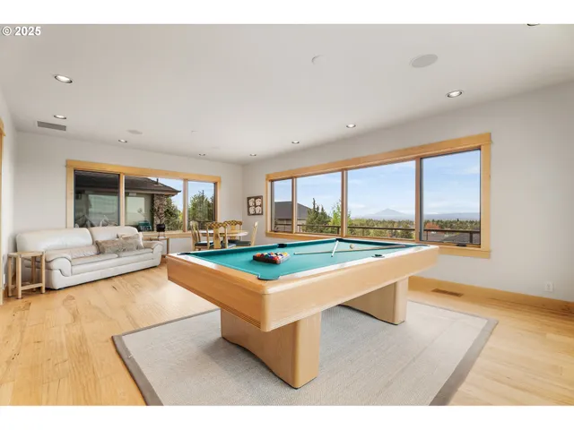 a living room with a table and a large window