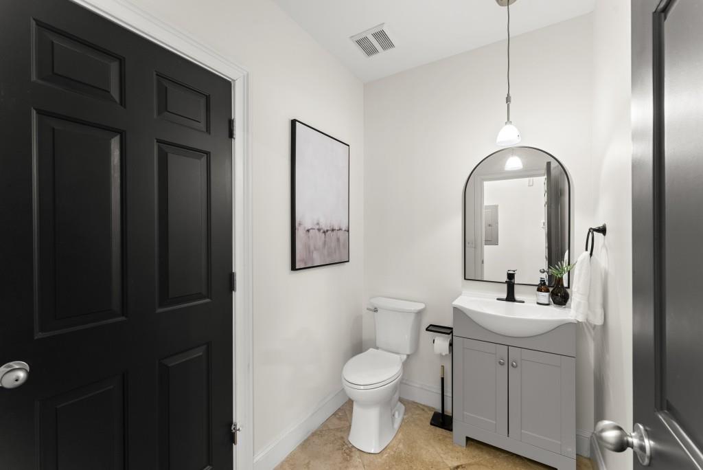 1635 Briarcliff Road Northeast, Unit 8 Atlanta, GA 30306 - Photo 12 of 25 a bathroom with a toilet sink and mirror