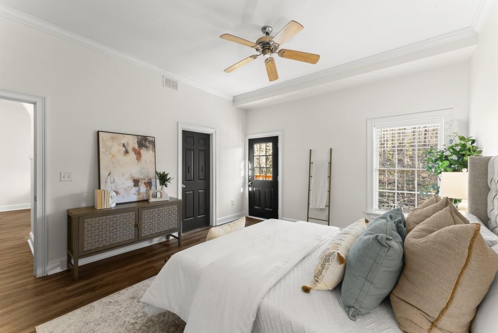 1635 Briarcliff Road Northeast, Unit 8 Atlanta, GA 30306 - Photo 13 of 25 a bedroom with a large bed couch and a window