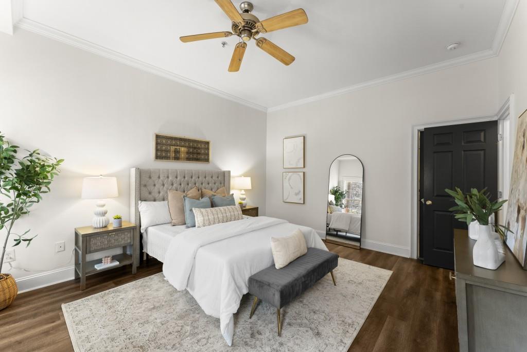 1635 Briarcliff Road Northeast, Unit 8 Atlanta, GA 30306 - Photo 14 of 25 a bedroom with a bed and a chandelier