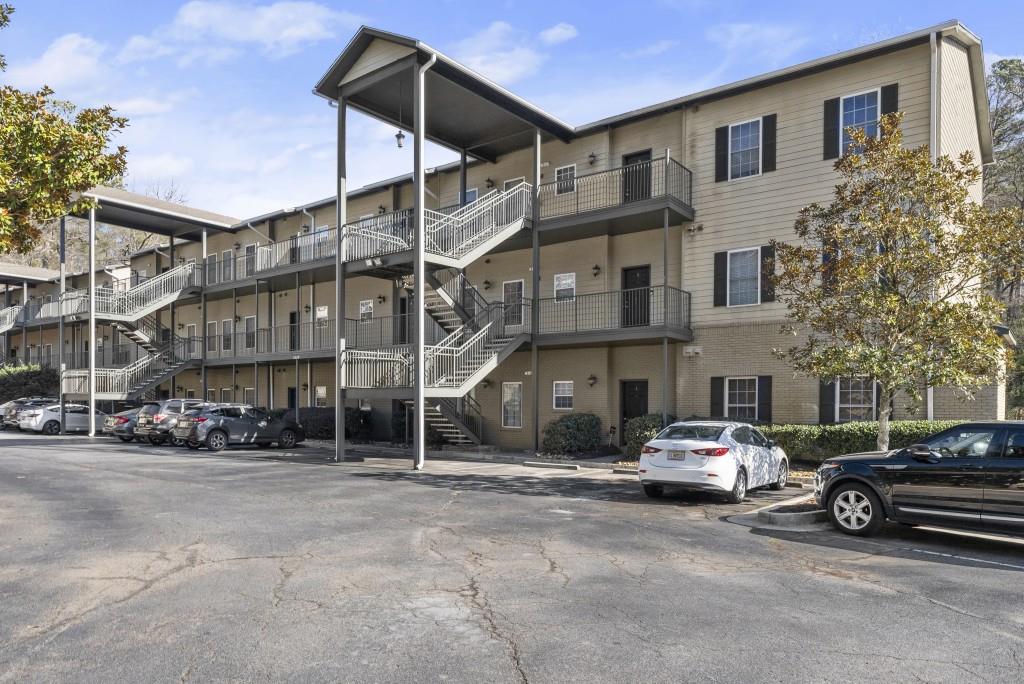 1635 Briarcliff Road Northeast, Unit 8 Atlanta, GA 30306 - Photo 25 of 25 a car parked in front of a building
