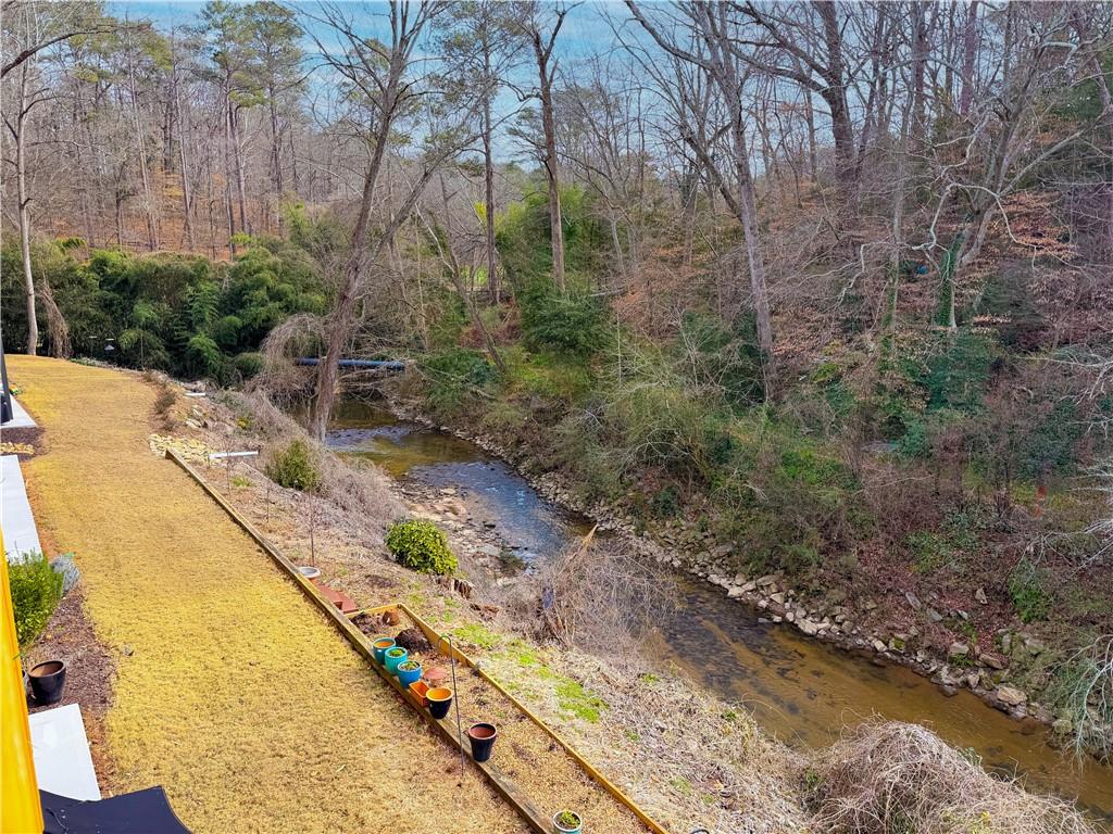 1635 Briarcliff Road Northeast, Unit 8 Atlanta, GA 30306 - Photo 5 of 25 a view of a lake with a mountain
