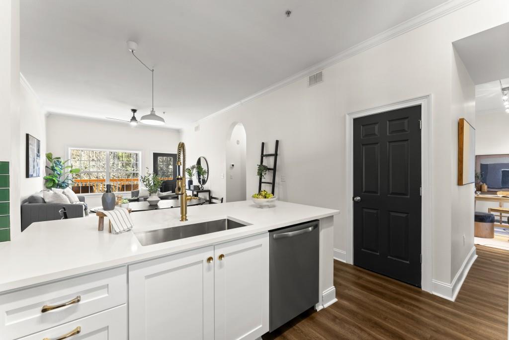 1635 Briarcliff Road Northeast, Unit 8 Atlanta, GA 30306 - Photo 7 of 25 a kitchen with sink refrigerator and large window