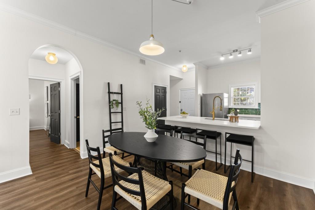 1635 Briarcliff Road Northeast, Unit 8 Atlanta, GA 30306 - Photo 9 of 25 a view of a dining room with furniture and wooden floor