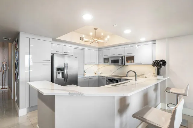 a living room with fireplace furniture and a flat screen tv