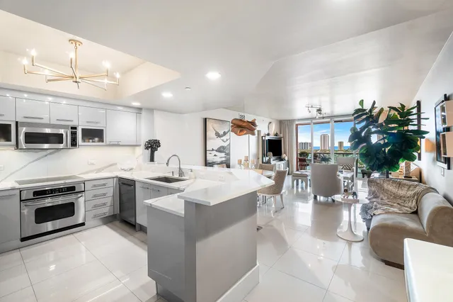 a living room with fireplace furniture and a flat screen tv