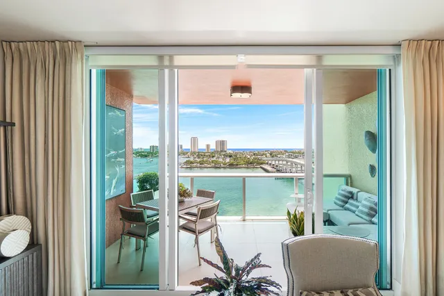 a view of a balcony with chair and table