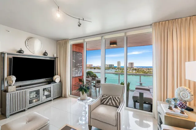 a balcony with dining table and chairs