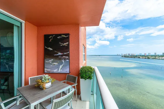 a bathroom with a double vanity sink mirror and toilet