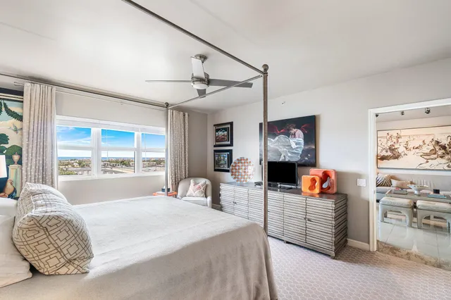 a bathroom with a sink and mirror with shower