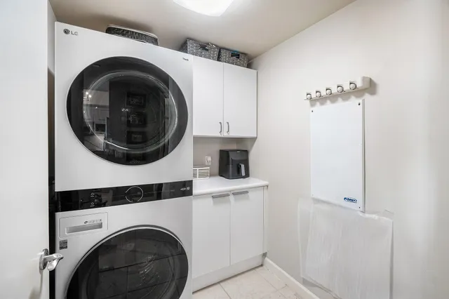 a view of swimming pool with outdoor seating and city view